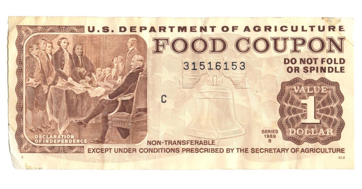 $1 Food Coupon.  Grunge and textured details.  Issued first in 1989.  Same monetary value as U.S. currency but can only be used to buy food.  Given by the government to people in need.  Serial number has been altered, to protect the poor. (Getty Images/Stock photo)