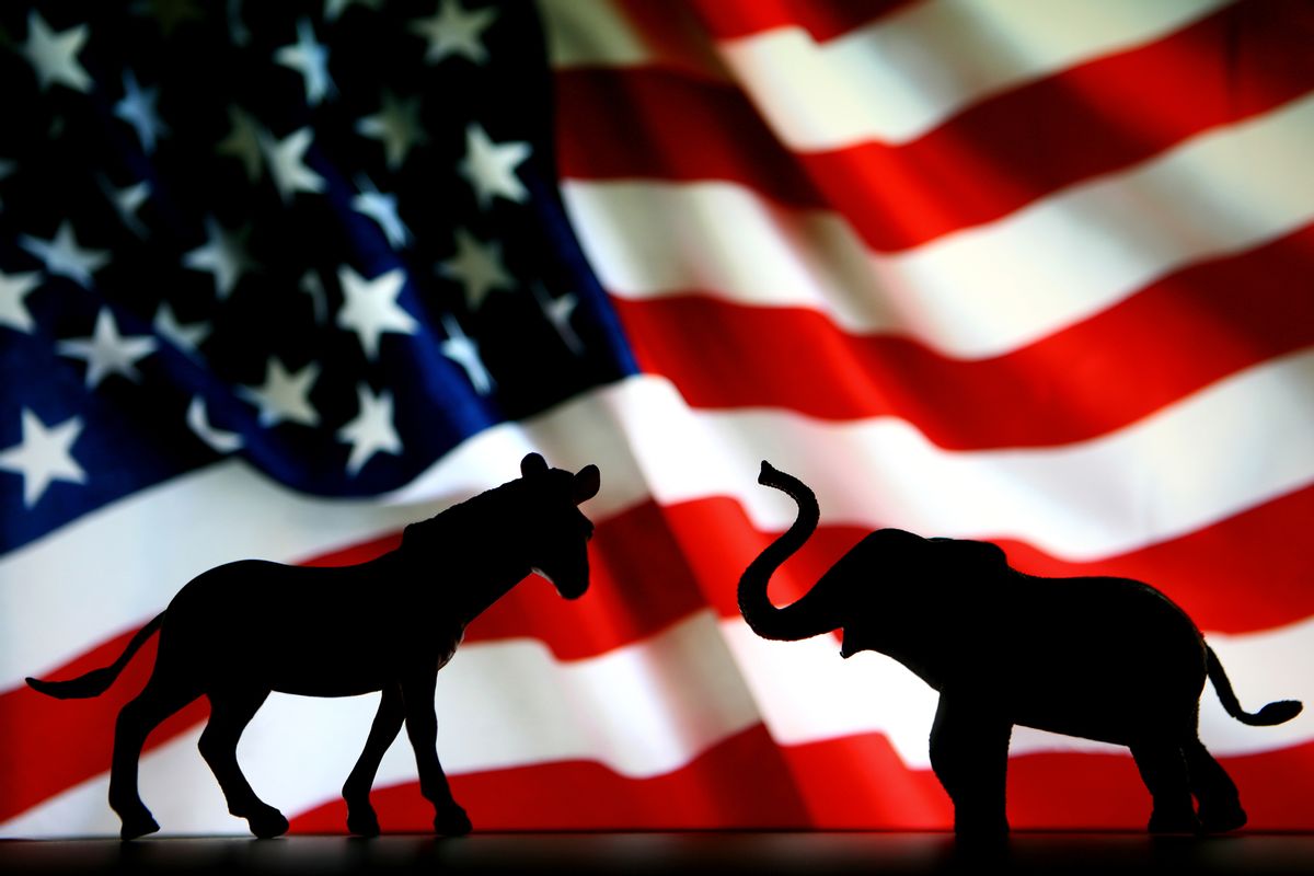 Silhouette of a Donkey and an Elephant in front of an American Flag. (Getty Images/Stock photo)