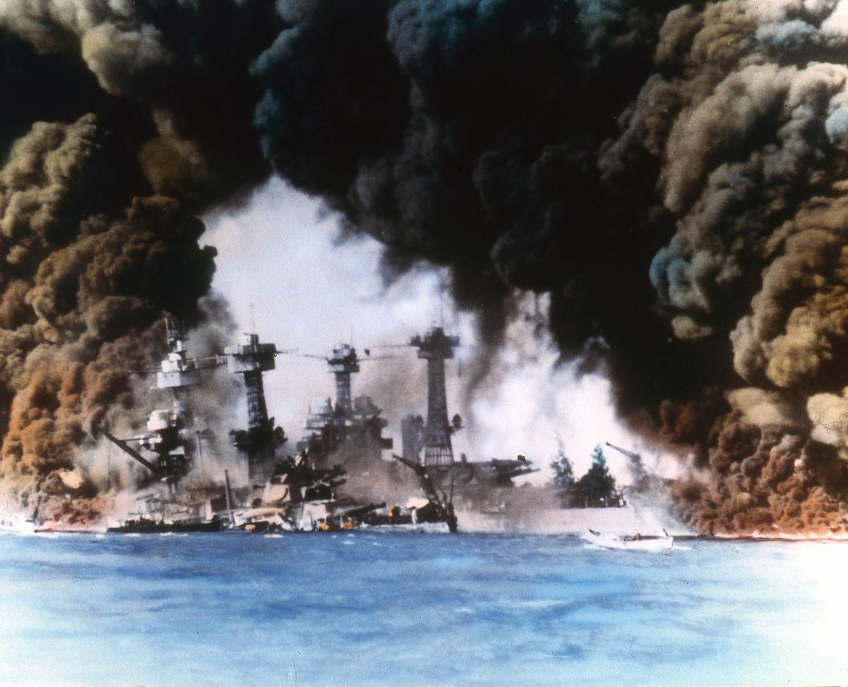 Thick smoke billows up from stricken American warships (from left, USS West Virginia and USS Tennessee) along battleship row during the Japanese attack on Pearl Harbor, Honolulu, Oahu, Hawaii, December 7, 1941. (Photo by US Navy/Interim Archives/Getty Images) (US Navy/Interim Archives/Getty Images)