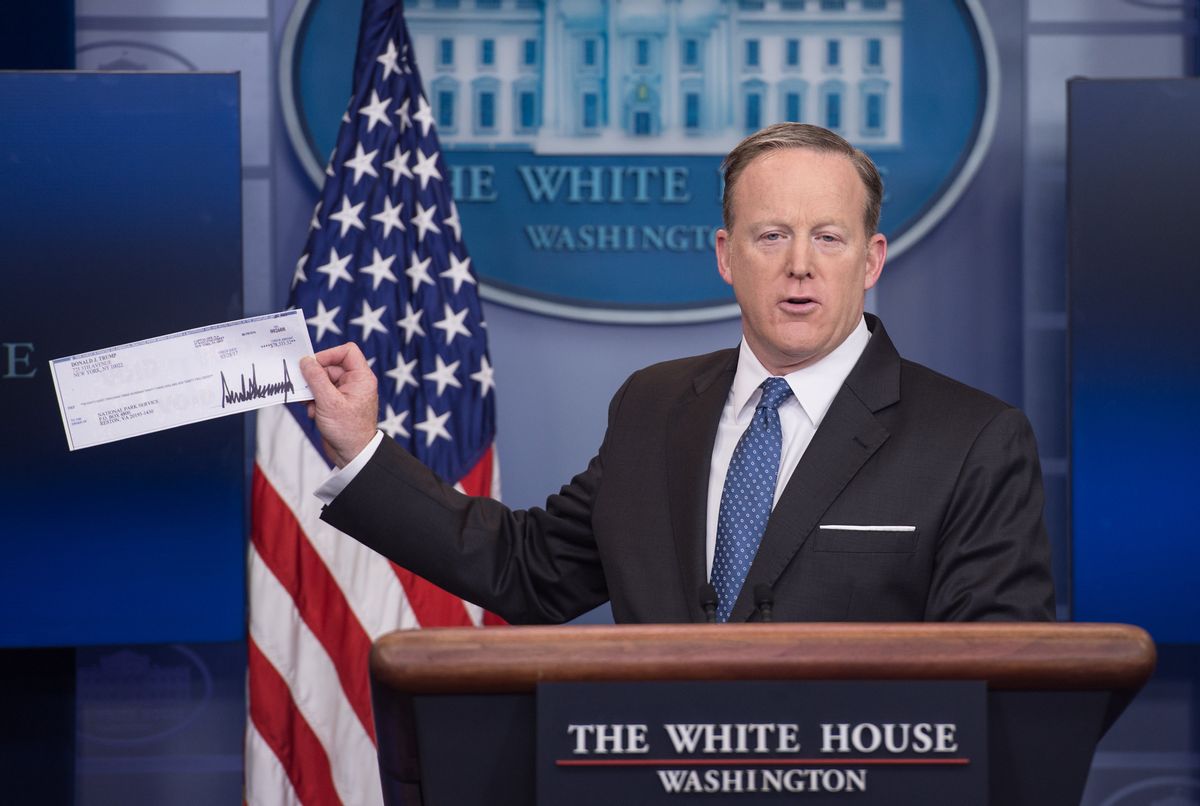 White House spokesman Sean Spicer displays the first quarter check of US President Donald Trump's salary which he donated to the National Park Service during the daily press briefing at the White House in Washington, DC, on April 3, 2017. / AFP PHOTO / NICHOLAS KAMM        (Photo credit should read NICHOLAS KAMM/AFP via Getty Images) (NICHOLAS KAMM/AFP via Getty Images)