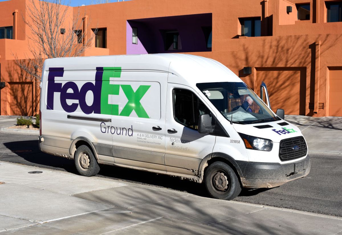 SANTA FE, NEW MEXICO - DECEMBER 21, 2019: A FedEx (Federal Express) deliveryman returns to his truck after making a delivery in Santa Fe, New Mexico. (Photo by Robert Alexander/Getty Images) (Getty Images/Stock photo)