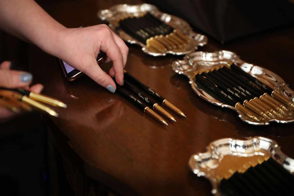 WASHINGTON, DC - JANUARY 15: Pens with U.S. Speaker of the House Nancy Pelosi's (D-CA) signature are prepared for the engrossment ceremony of the articles of impeachment against President Donald Trump in the Rayburn Room at the U.S. Capitol January 15, 2020 in Washington, DC. The House of Representatives voted to approve the managers and send the articles of impeachment to the Senate, where Majority Leader Mitch McConnell (R-KY) said the trial will begin next Tuesday. (Photo by Chip Somodevilla/Getty Images) (Getty Images)