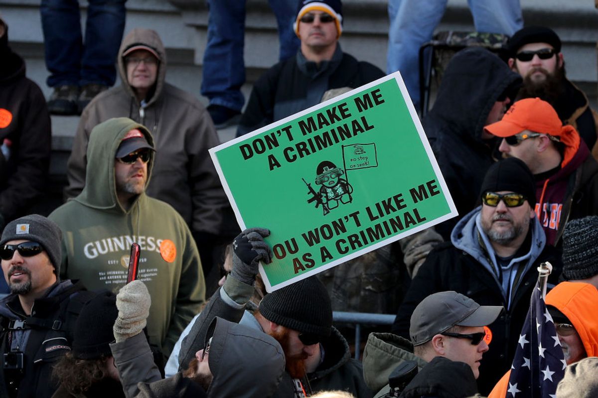 RICHMOND, VIRGINIA - JANUARY 20: Thousands of gun rights advocates attend a rally organized by The Virginia Citizens Defense League on Capitol Square near the state capitol building January 20, 2020 in Richmond, Virginia. During elections last year, Virginia Governor Ralph Northam promised to enact sweeping gun control laws in 2020, including limiting handgun purchase to one per month, banning military-style weapons and silencers, allowing localities to ban guns in public spaces and enacting a 'red flag' law so authorities can temporarily seize weapons from someone deemed a threat. While event organizers have asked supporters to show up un-armed, militias and other extremist groups from across the country plan to attend the rally and show their support for gun rights. (Photo by Chip Somodevilla/Getty Images) (Getty Images)