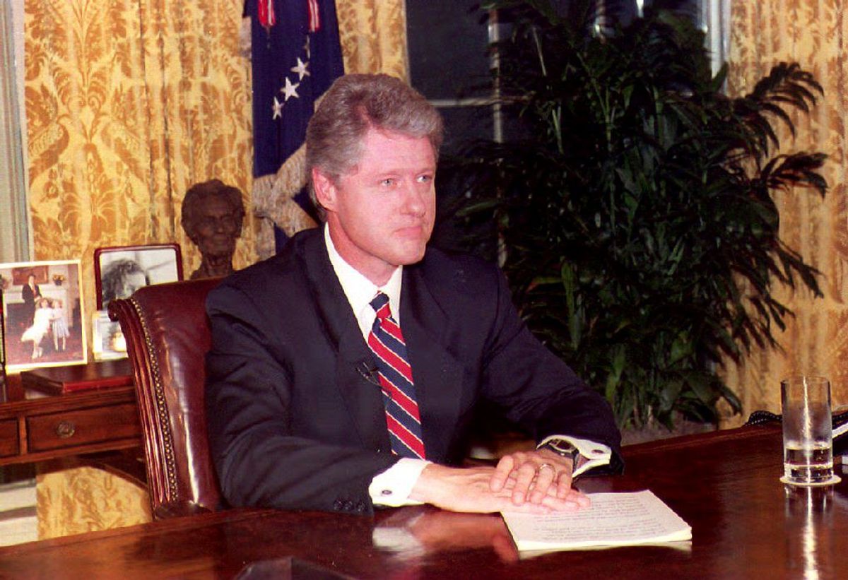 WASHINGTON, DC - JUNE 26:  U.S. President Bill Clinton sits at his desk 26 June, 1993 in the Oval Office in Washington, DC following his address to the nation in which he announced the U.S. attack against an Iraqi intelligence target in Baghdad. Clinton said the attack was carried out on the basis of "compelling evidence" of a plot to assassinate former U.S. President George Bush.  (Photo credit should read JENNIFER LAW/AFP via Getty Images) (Getty Images/Stock photo)