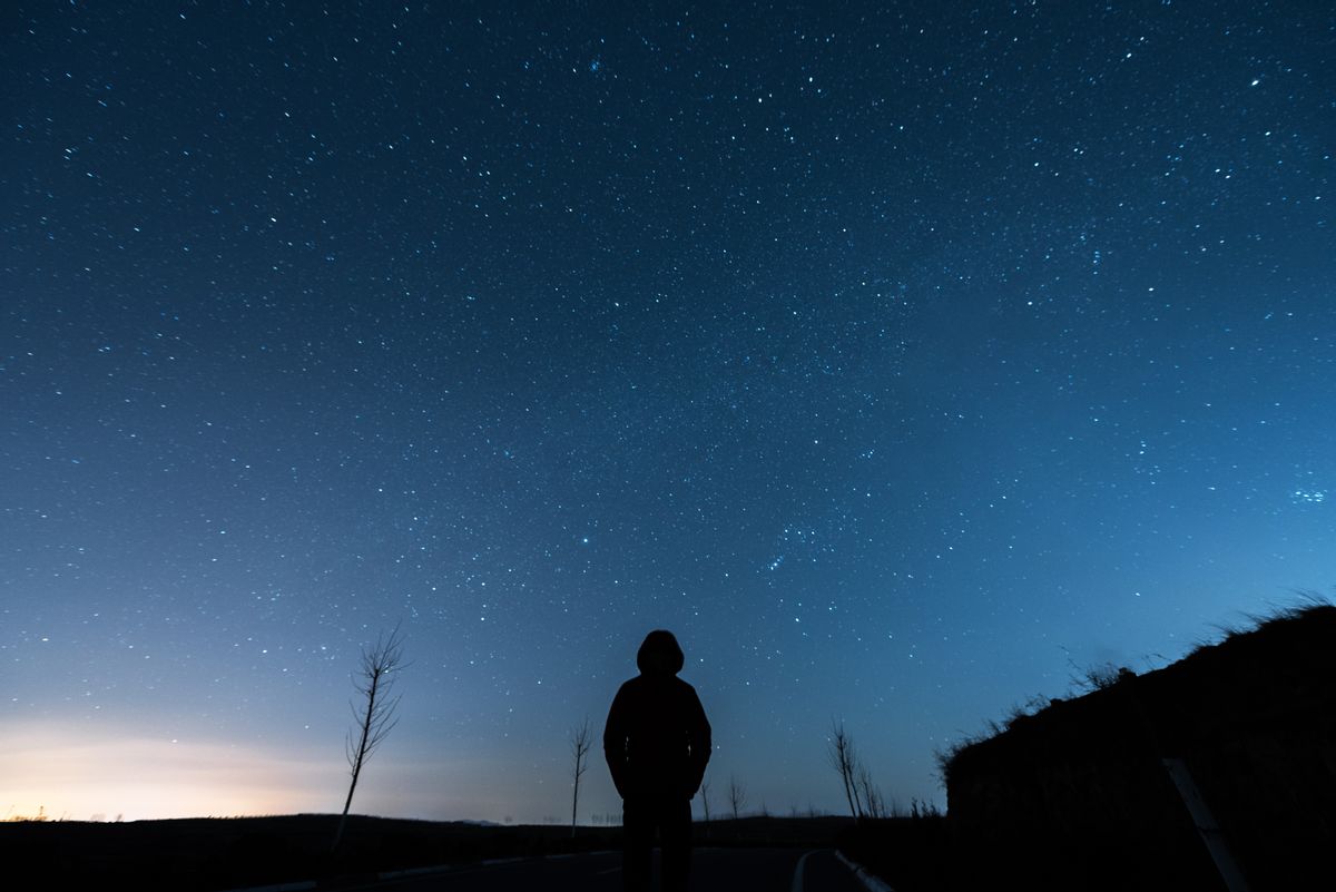 Man under Sky in Starry night (Getty Images, stock photo illustration)