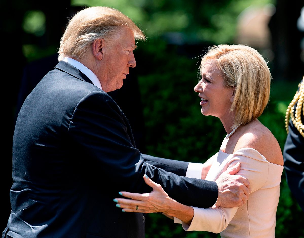 US President Donald Trump talks to Paula White after an event to celebrate a national day of prayer in the Rose Garden of the White House in Washington, DC on May 2, 2019. (Photo by Brendan SMIALOWSKI / AFP) / ALTERNATIVE CROP        (Photo credit should read BRENDAN SMIALOWSKI/AFP via Getty Images) (BRENDAN SMIALOWSKI/AFP via Getty Images)