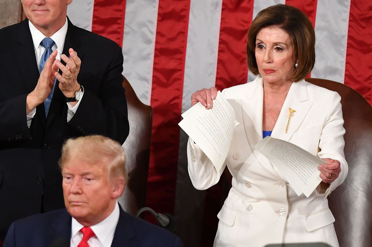 US Vice President Mike Pence claps as Speaker of the US House of Representatives Nancy Pelosi appears to rip a copy of US President Donald Trumps speech after he delivers the State of the Union address at the US Capitol in Washington, DC, on February 4, 2020. (Photo by MANDEL NGAN / AFP) (Photo by MANDEL NGAN/AFP via Getty Images) (MANDEL NGAN/AFP via Getty Images)