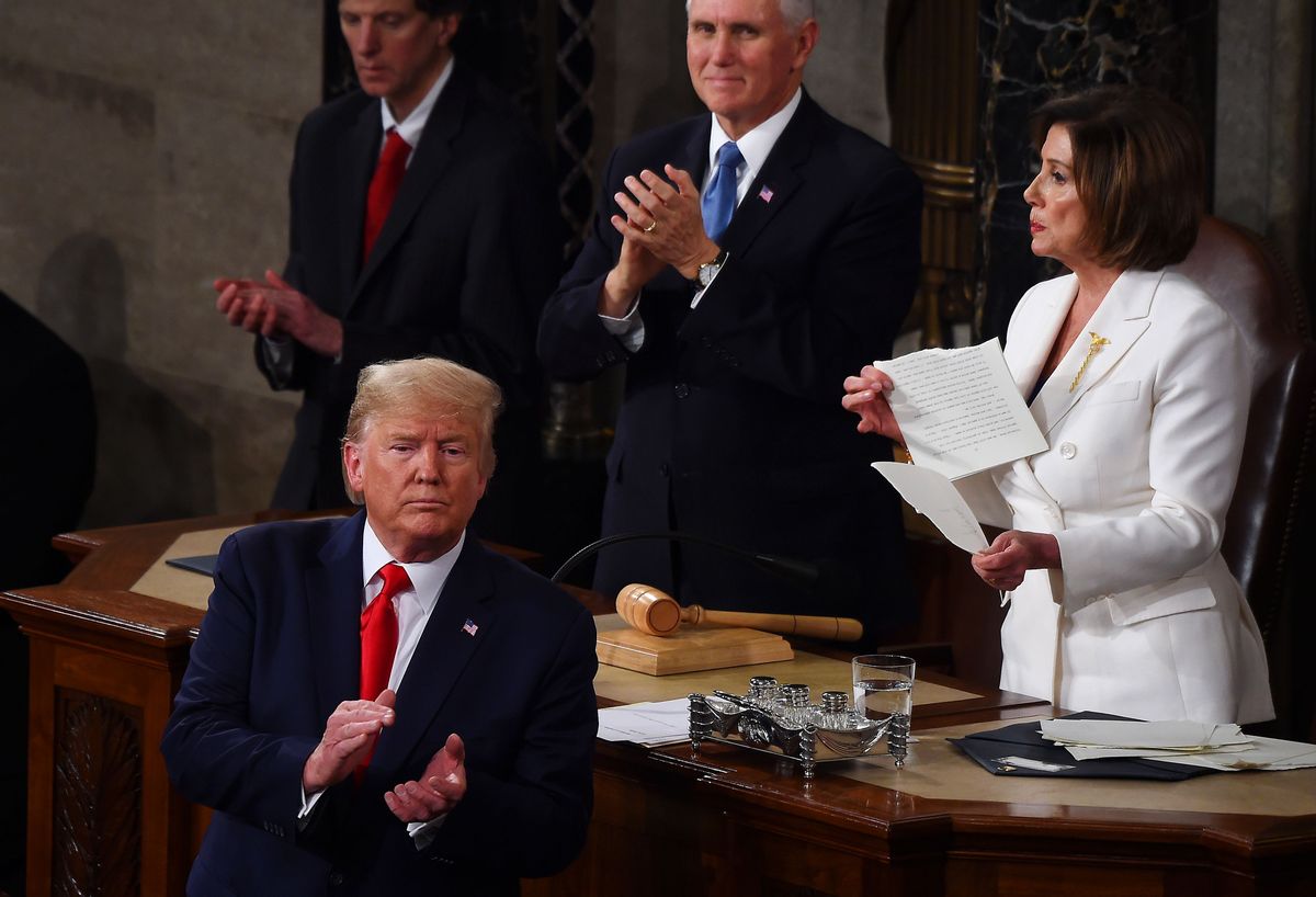 TOPSHOT - Speaker of the US House of Representatives Nancy Pelosi rips a copy of US President Donald Trumps speech after he delivered the State of the Union address at the US Capitol in Washington, DC, on February 4, 2020. (Photo by Olivier DOULIERY / AFP) (Photo by OLIVIER DOULIERY/AFP via Getty Images) (OLIVIER DOULIERY/AFP via Getty Images)
