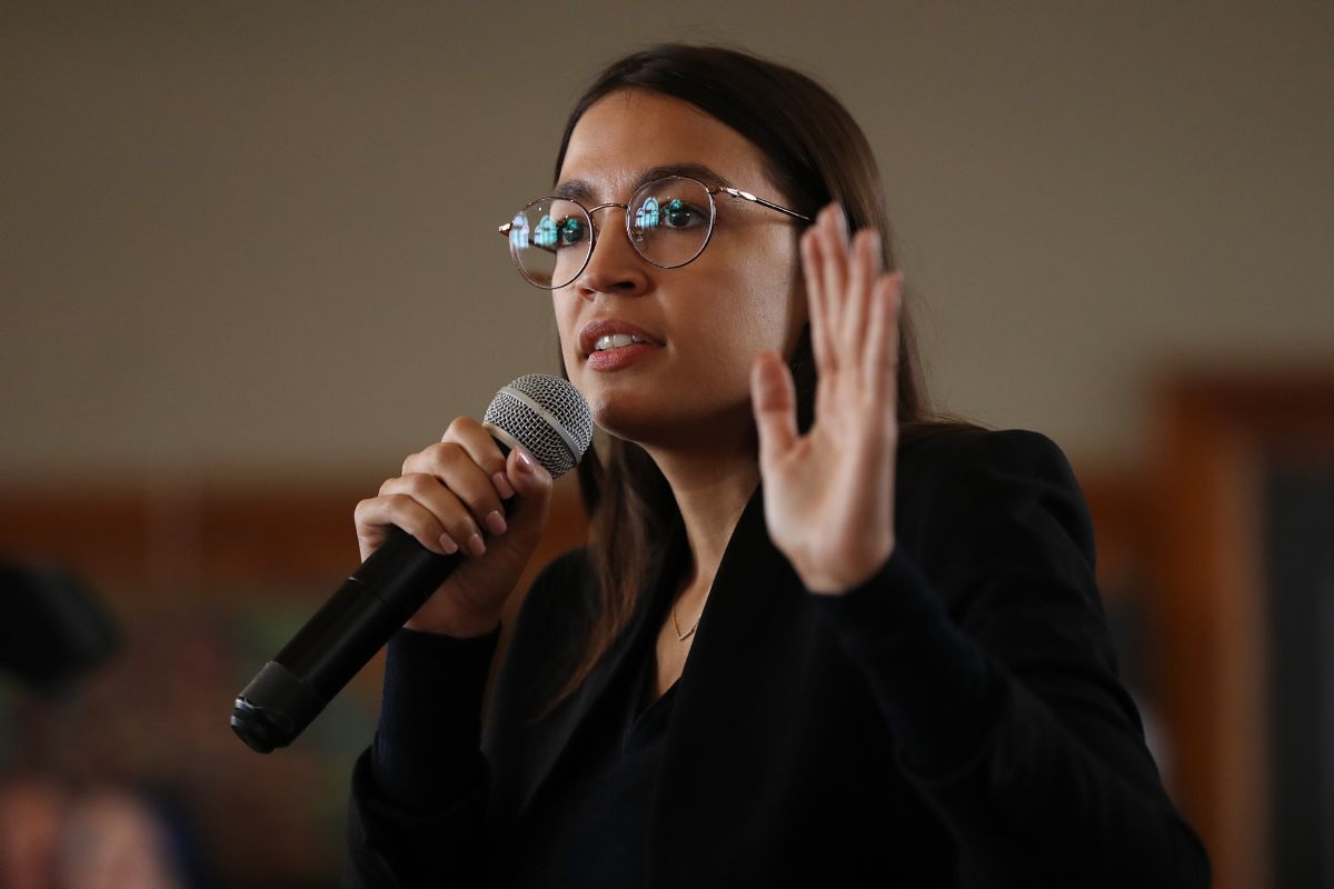 PERRY, IOWA - JANUARY 26:  Rep. Alexandria Ocasio-Cortez (D-NY) speaks during a campaign event with Democratic presidential candidate Sen. Bernie Sanders (I-VT) at La Poste January 26, 2020 in Perry, Iowa. A New York Times/Siena College poll conducted January 20-23 places Sanders at the top of a long list of Democrats seeking the presidential nomination with 25-percent of likely Iowa caucus-goers naming him as their first choice. Candidates former South Bend, Indiana Mayor Pete Buttigieg, former Vice President Joe Biden and Sen. Elizabeth Warren (D-MA) are polling at 18, 17 and 15-percent, respectively. 
 (Photo by Chip Somodevilla/Getty Images) (Chip Somodevilla/Getty Images)