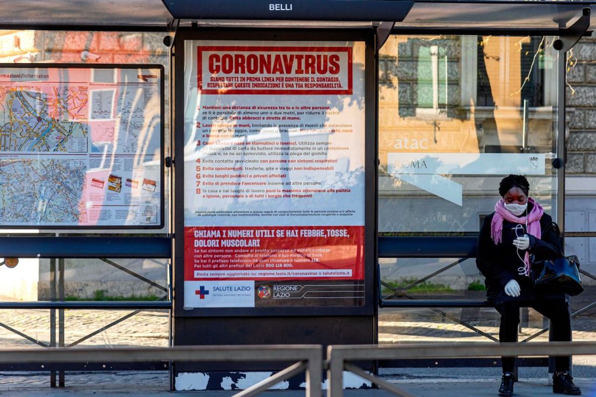 ROME, ITALY - MARCH 16: A warning at the tram stop about best practices to avoid the coronavirus (COVID-19) in the Trastevere neighborhood (COVID-19) on March 16, 2020, in Rome, Italy. The Italian Government has taken the unprecedented measure of a nationwide lockdown by closing all businesses except essential services such as, pharmacies, grocery stores, hardware stores and tobacconists and banks, in an effort to fight the world's second-most deadly coronavirus (COVID-19) outbreak outside of China. The movements in and out are allowed only for work and health reasons proven by a medical certificate. The number of confirmed cases of the Coronavirus COVID-19 disease in Italy has jumped up to at least 27980 while the death toll have reached 2158. (Photo by Stefano Montesi - Corbis/ Getty Images) (Getty Images)