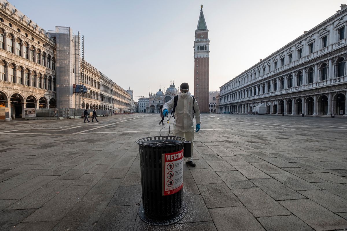 VENICE, ITALY - MARCH 11: Ecological operator sanitizes a garbage can in Piazza San Marco against coronavirus on March 11, 2020 in Venice, Italy. The Italian Government has taken the unprecedented measure of a nationwide lock-down, in an effort to fight the world's second-most deadly coronavirus outbreak outside of China.The movements in and out are allowed only for work reasons, health reasons proven by a medical certificate.The justifications for the movements needs to be certified with a self-declaration by filling in forms provided by the police forces in charge of the checks. (Photo by Stefano Mazzola/Awakening/Getty Images) (Stefano Mazzola/Awakening/Getty Images)
