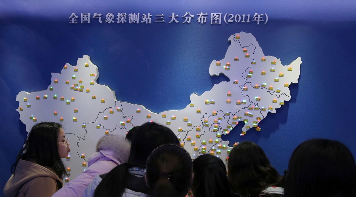 This photo taken on March 22, 2017 shows Chinese students looking at a meteorological station map as they visit the Museum of Meteorology to mark World Meteorological Day in Nantong, east China's Jiangsu province. 
World Meteorological Day, observed annually on March 23, commemorates the establishment of the World Meteorological Organisation. / AFP PHOTO / STR / China OUT        (Photo credit should read STR/AFP via Getty Images) (Getty Images)