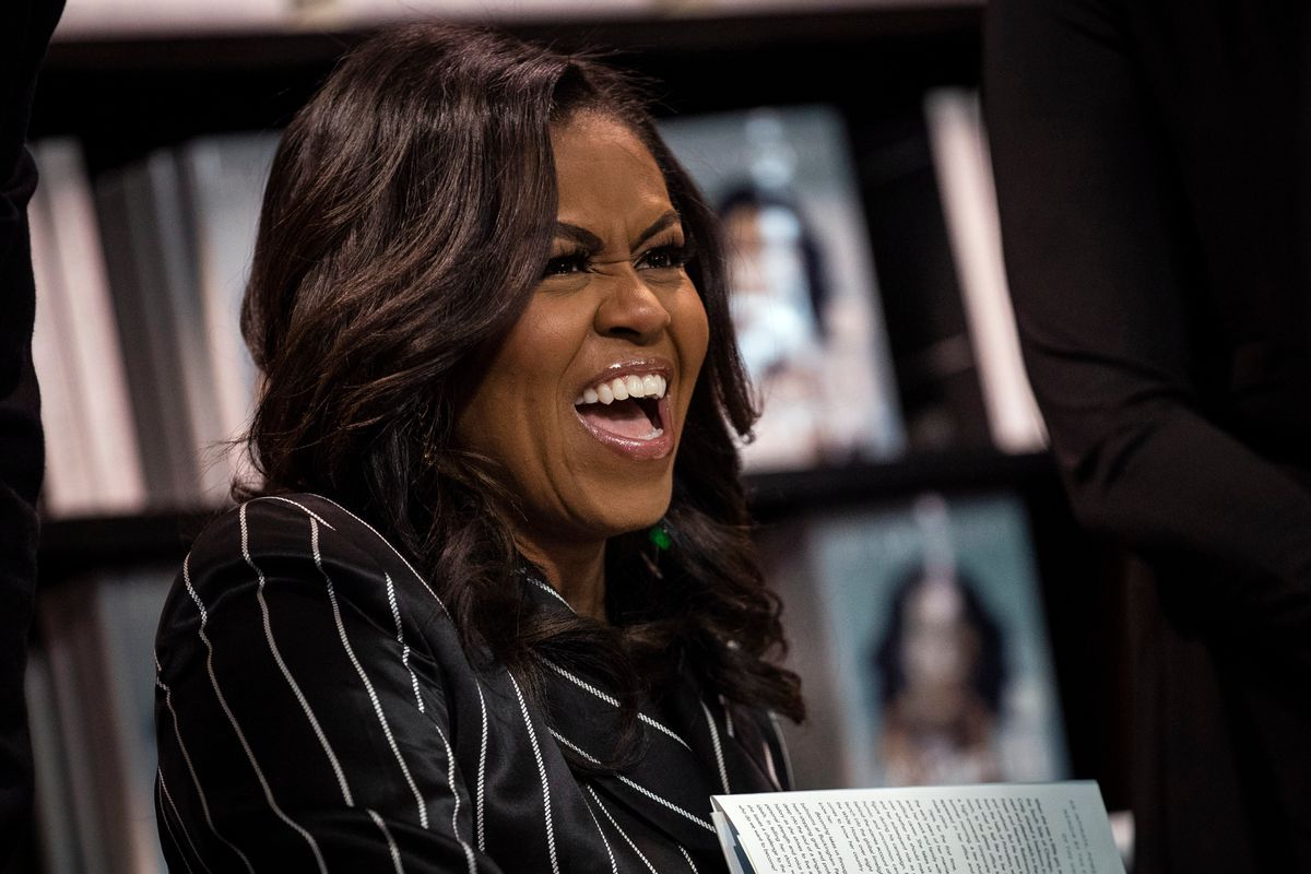 NEW YORK, NY - NOVEMBER 30: Former U.S. First Lady Michelle Obama laughs while signing copies of her new book 'Becoming' during a book signing event at a Barnes &amp; Noble bookstore, November 30, 2018 in New York City. The former first lady's memoir has sold more than 2 million copies in all formats in North America during its first 15 days on the market, according to a statement released on Friday by Penguin Random House. (Photo by Drew Angerer/Getty Images) (Drew Angerer/Getty Images)