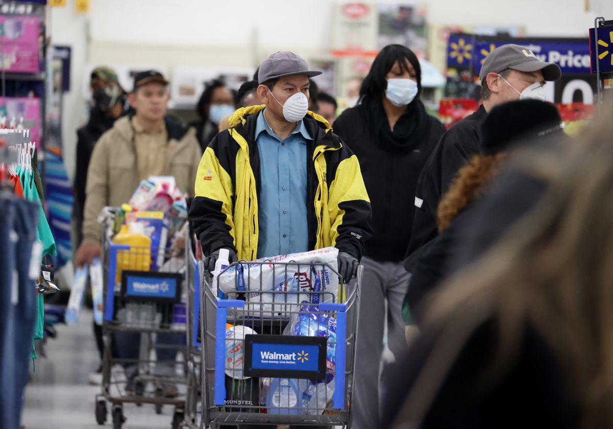 UNIONDALE, NEW YORK - APRIL 03:  People wearing masks and gloves wait to checkout at Walmart on April 03, 2020 in Uniondale, New York. The World Health Organization declared coronavirus (COVID-19) a global pandemic on March 11th.  (Photo by Al Bello/Getty Images) (Al Bello/Getty Images)