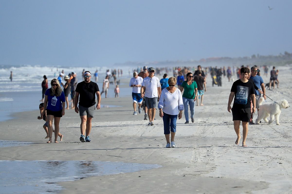 JACKSONVILLE BEACH, FLORIDA - APRIL 17: People are seen at the beach on April 17, 2020 in Jacksonville Beach, Florida. Jacksonville Mayor Lenny Curry announced Thursday that Duval County's beaches would open at 5 p.m. but only for restricted hours and can only be used for swimming, running, surfing, walking, biking, fishing, and taking care of pets. (Photo by Sam Greenwood/Getty Images) (Getty Images)