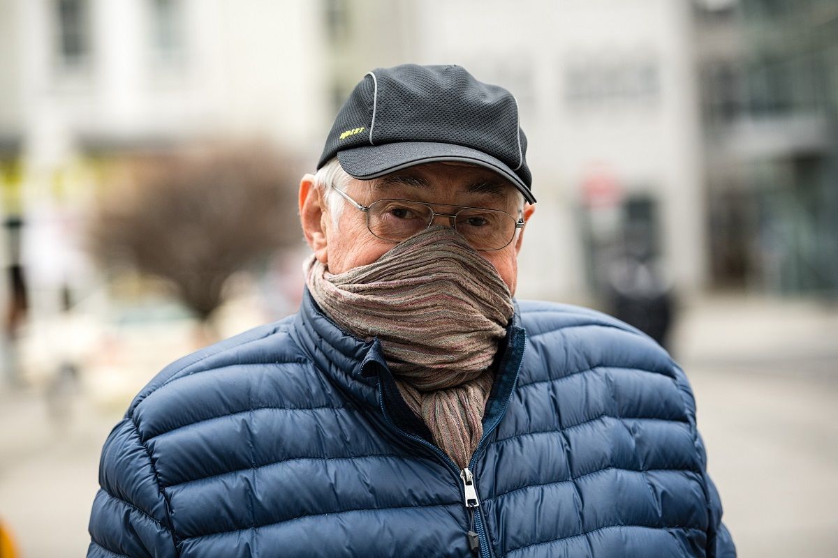 JENA, GERMANY - APRIL 03: A man wears a cloth as a protective face mask on April 3, 2020 in Jena, Germany. A three-part city ordinance is going into effect requiring people to wear protective face masks under circumstances that include shopping, riding public transport and workplaces where social distancing is difficult. A face mask requirement is a current issue of controversy across Germany, with the federal government so far declining to make wearing one in public mandatory. Germany is struggling with a shortage of face masks, and the requirement in Jena also allows the use of scarves and other materials to shield one's face as a means to reduce the risk of anyone infected with Covid-19 from infecting others. (Photo by Jens Schlueter/Getty Images) (Jens Schlueter / Getty Images)