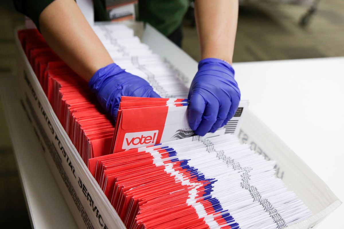 Election workers sort vote-by-mail ballots for the presidential primary at King County Elections in Renton, Washington on March 10, 2020. (Photo by Jason Redmond / AFP) (Photo by JASON REDMOND/AFP via Getty Images) (JASON REDMOND/AFP via Getty Images)