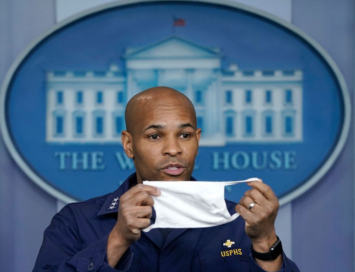 WASHINGTON, DC - APRIL 22: U.S. Surgeon General Jerome Adams holds up his face mask during the daily briefing of the coronavirus task force at the White House on April 22, 2020 in Washington, DC. Dr. Redfield, has said that a potential second wave of coronavirus later this year could flare up again and coincide with flu season. (Photo by Drew Angerer/Getty Images) (Getty Images)