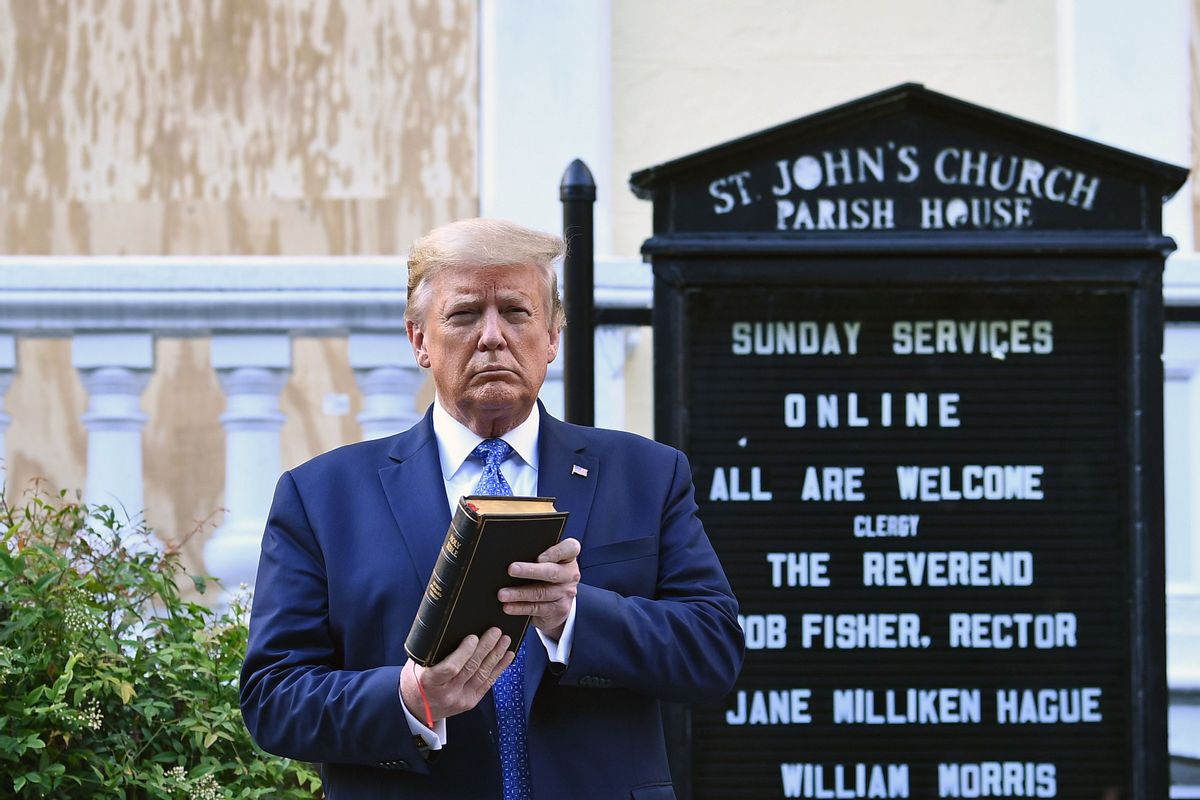 US President Donald Trump holds up a Bible outside of St John's Episcopal church across Lafayette Park in Washington, DC on June 1, 2020. - US President Donald Trump was due to make a televised address to the nation on Monday after days of anti-racism protests against police brutality that have erupted into violence.
The White House announced that the president would make remarks imminently after he has been criticized for not publicly addressing in the crisis in recent days. (Photo by Brendan Smialowski / AFP) (Photo by BRENDAN SMIALOWSKI/AFP via Getty Images) (BRENDAN SMIALOWSKI/AFP via Getty Images)