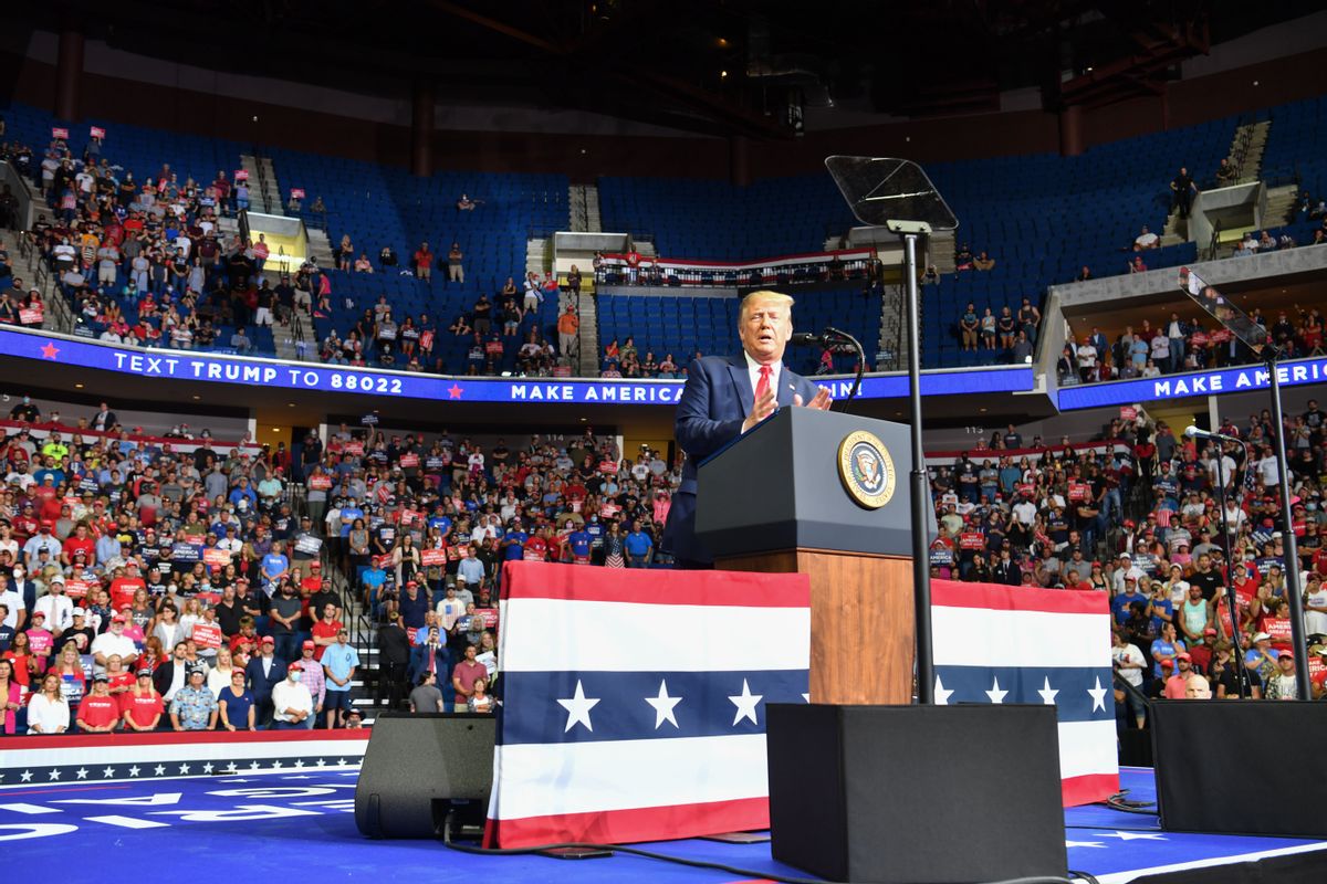 TOPSHOT - The upper section is seen partially empty as US President Donald Trump speaks during a campaign rally at the BOK Center on June 20, 2020 in Tulsa, Oklahoma. - Hundreds of supporters lined up early for Donald Trump's first political rally in months, saying the risk of contracting COVID-19 in a big, packed arena would not keep them from hearing the president's campaign message. (Photo by Nicholas Kamm / AFP) (Photo by NICHOLAS KAMM/AFP via Getty Images) (NICHOLAS KAMM/AFP via Getty Images)