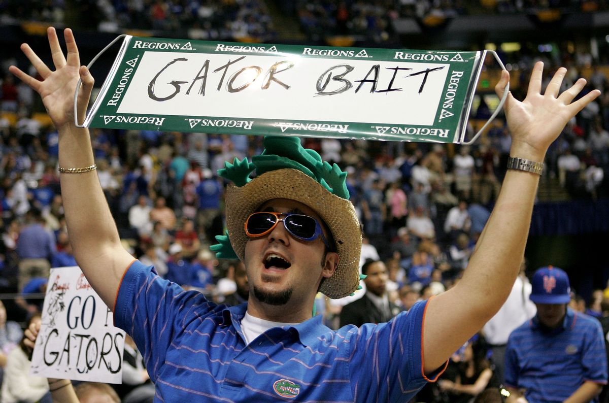 NASHVILLE, TN - MARCH 11:  A fan of the Florida Gators holds up a sign that reads "Gator Bait" against the LSU Tigers during the semifinals on day 3 of the SEC Men's Basketball Conference Tournament March 11, 2006 at the Gaylord Entertainment Center in Nashville, Tennessee.  (Photo by Andy Lyons/Getty Images) (Andy Lyons/Getty Images)