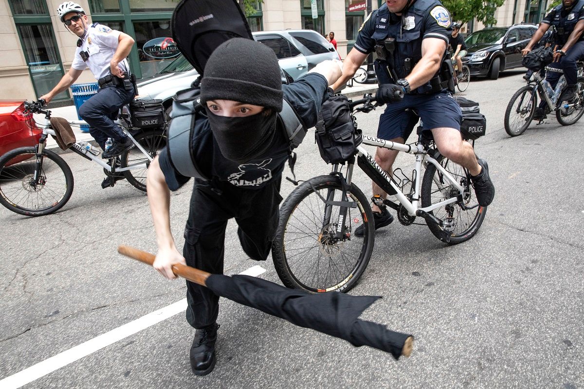 WASHINGTON,DC-JULY6: A police officer pushes an Antifa  protester out of the street during protests in Washington, DC, July 6, 2019. (Photo by Evelyn Hockstein/For The Washington Post via Getty Images) (Evelyn Hockstein/For The Washington Post via Getty Images)
