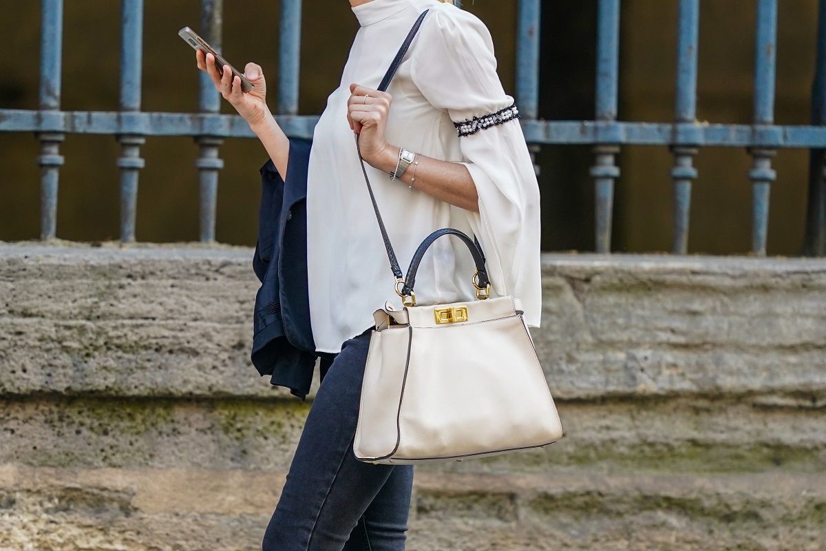 PARIS, FRANCE - JUNE 03: A passerby wears a white Fendi bag, a white flowing top, a watch, on June 03, 2020 in Paris, France. (Photo by Edward Berthelot/Getty Images) (Edward Berthelot / Getty Images)