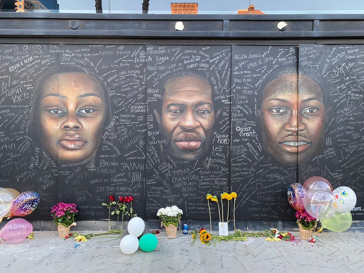 Local artists in Long Beach, California, painted a mural honoring Breonna Taylor, George Floyd and Ahmaud Arbery during the Black Lives Matter protests of spring 2020. (Bethania Palma / Snopes.com)