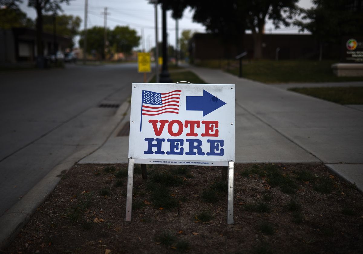 MINNEAPOLIS, MN - AUGUST 14: A sign reading "Vote Here" points toward a polling place for the 2018 Minnesota primary election at Holy Trinity Lutheran Church on August 14, 2018 in Minneapolis, Minnesota. (Photo by Stephen Maturen/Getty Images) (Stephen Maturen/Stringer.)