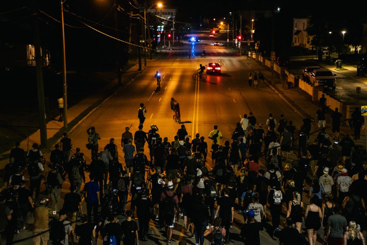 KENOSHA, WI - AUGUST 26: Demonstrators march in the streets on August 26, 2020 in Kenosha, Wisconsin. As the city declared a state of emergency curfew, a fourth night of civil unrest occurred after the shooting of Jacob Blake, 29, on August 23. Video shot of the incident appears to show Blake shot multiple times in the back by Wisconsin police officers while attempting to enter the drivers side of a vehicle. The 29-year-old Blake was undergoing surgery for a severed spinal cord, shattered vertebrae and severe damage to organs, according to the family attorneys in published accounts. (Photo by Brandon Bell/Getty Images) (Getty Images)