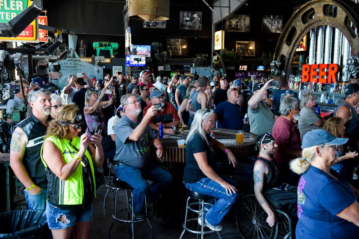 STURGIS, SD - AUGUST 09: People watch a concert at the Full Throttle Saloon during the 80th Annual Sturgis Motorcycle Rally in Sturgis, South Dakota on August 9, 2020. While the rally usually attracts around 500,000 people, officials estimate that more than 250,000 people may still show up to this year's festival despite the coronavirus pandemic. (Photo by Michael Ciaglo/Getty Images) (Getty Images)