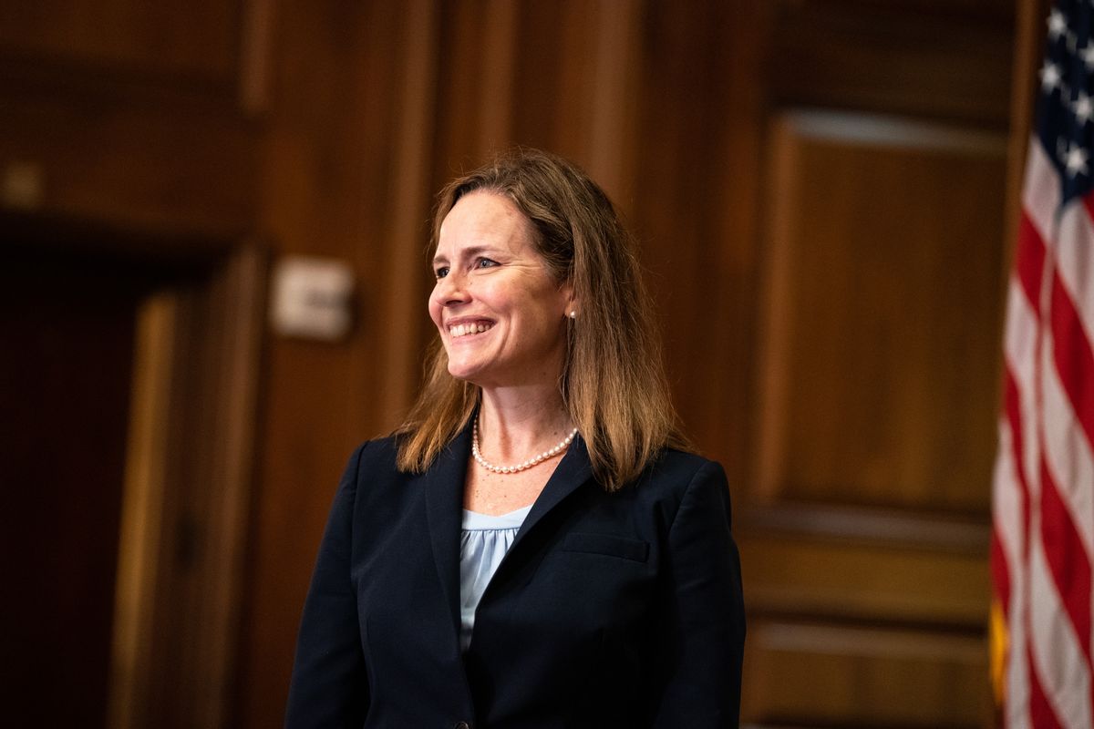 WASHINGTON, DC - SEPTEMBER 29:  Seventh U.S. Circuit Court Judge Amy Coney Barrett, President Donald Trump's nominee for the U.S. Supreme Court, meets with Senator David Perdue, (R-GA), before a meeting at the United States Capitol Building in Washington DC  on September 29, 2020 in Washington, DC. (Photo by Anna Moneymaker-Pool/Getty Images) (Pool / Pool)