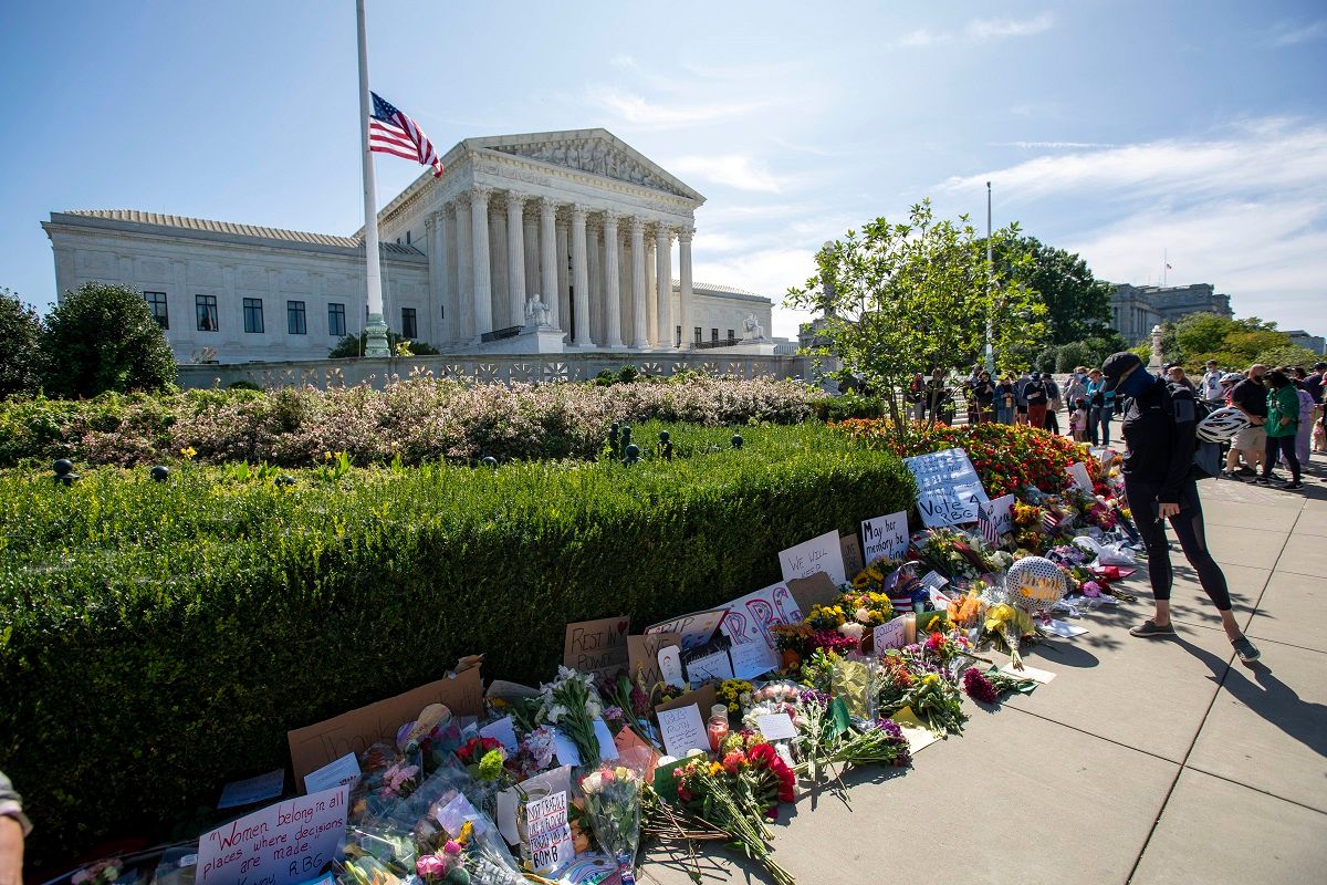People place flowers outside of the US Supreme Court in memory of Justice Ruth Bader Ginsburg, in Washington, DC, on September 19, 2020. - Ginsburg died September 18, opening a crucial vacancy on the high court expected to set off a pitched political battle at the peak of the presidential campaign. (Photo by Jose Luis Magana / AFP) (Photo by JOSE LUIS MAGANA/AFP via Getty Images) (Jose Luis Magana / AFP / Getty Images)