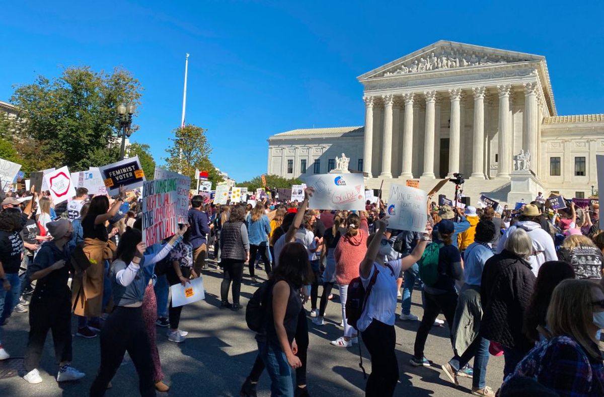 Demonstrators march past the Supreme Court in the nationwide Women's March on October 17, 2020, in Washington, DC. (Photo by Daniel SLIM / AFP) (Photo by DANIEL SLIM/AFP via Getty Images) (DANIEL SLIM/AFP via Getty Images)
