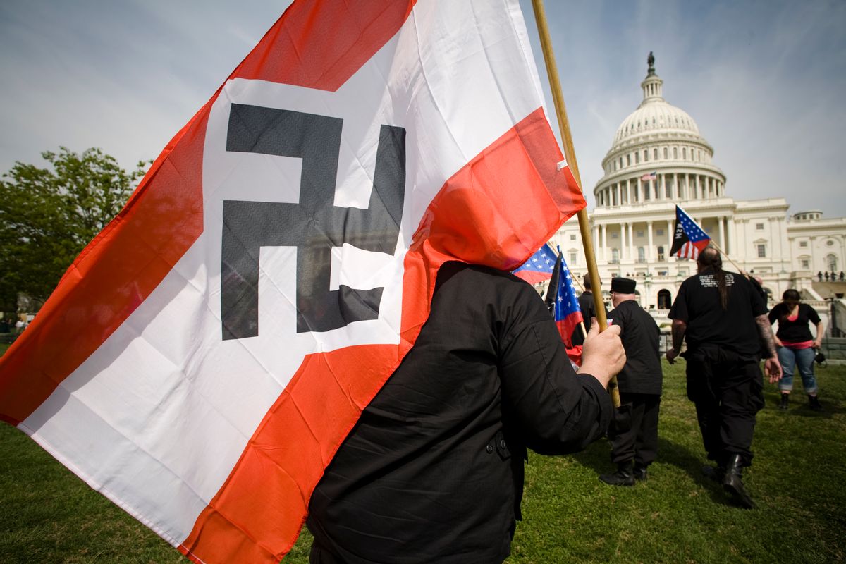 WASHINGTON, DC - APRIL 19:  Members of the National Socialist Movement (NSM) wave American Flags and NSM flags as they march from the Washington Monument to the grounds of the United States Capitol Building on April 19, 2008 in Washington, DC. Between 30-40 members of the group marched to bring attention to their views on illegal immigration and the city had about 1200 police officers on duty. (photo by David S. Holloway/Reportage by Getty Images) (David S. Holloway / Getty Images)