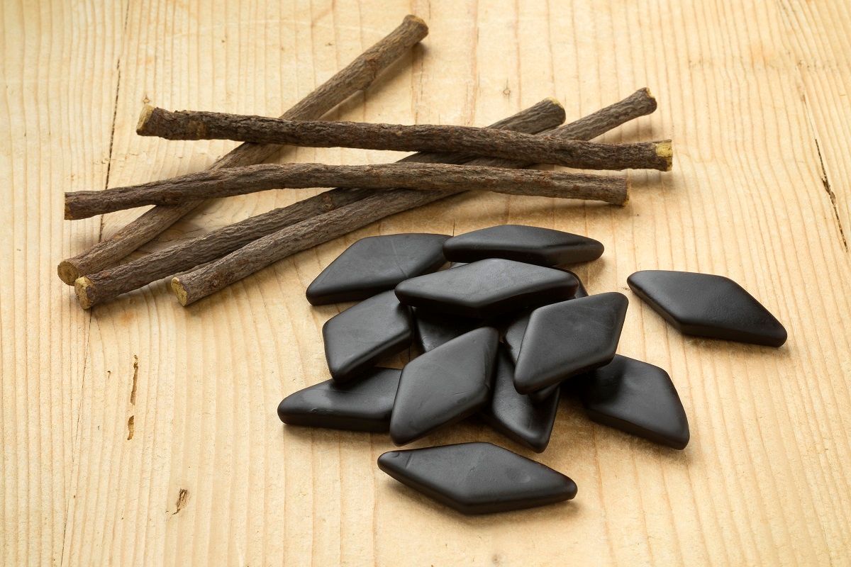 Heap of dried Licorice roots and black salt licorice confectionary, a Dutch treat (PicturePartners / Getty Images)