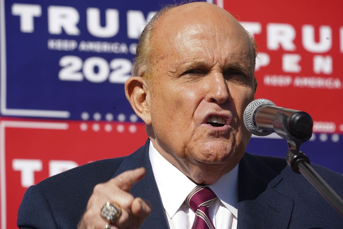 Attorney for the President, Rudy Giuliani, speaks at a news conference in the parking lot of a landscaping company on November 7, 2020 in Philadelphia. - Joe Biden has won the US presidency over Donald Trump, TV networks projected on November 7, 2020. CNN, NBC News and CBS News called the race in his favor, after projecting he had won the decisive state of Pennsylvania. (Photo by Bryan R. Smith / AFP) (Photo by BRYAN R. SMITH/AFP via Getty Images) (BRYAN R. SMITH/AFP via Getty Images)