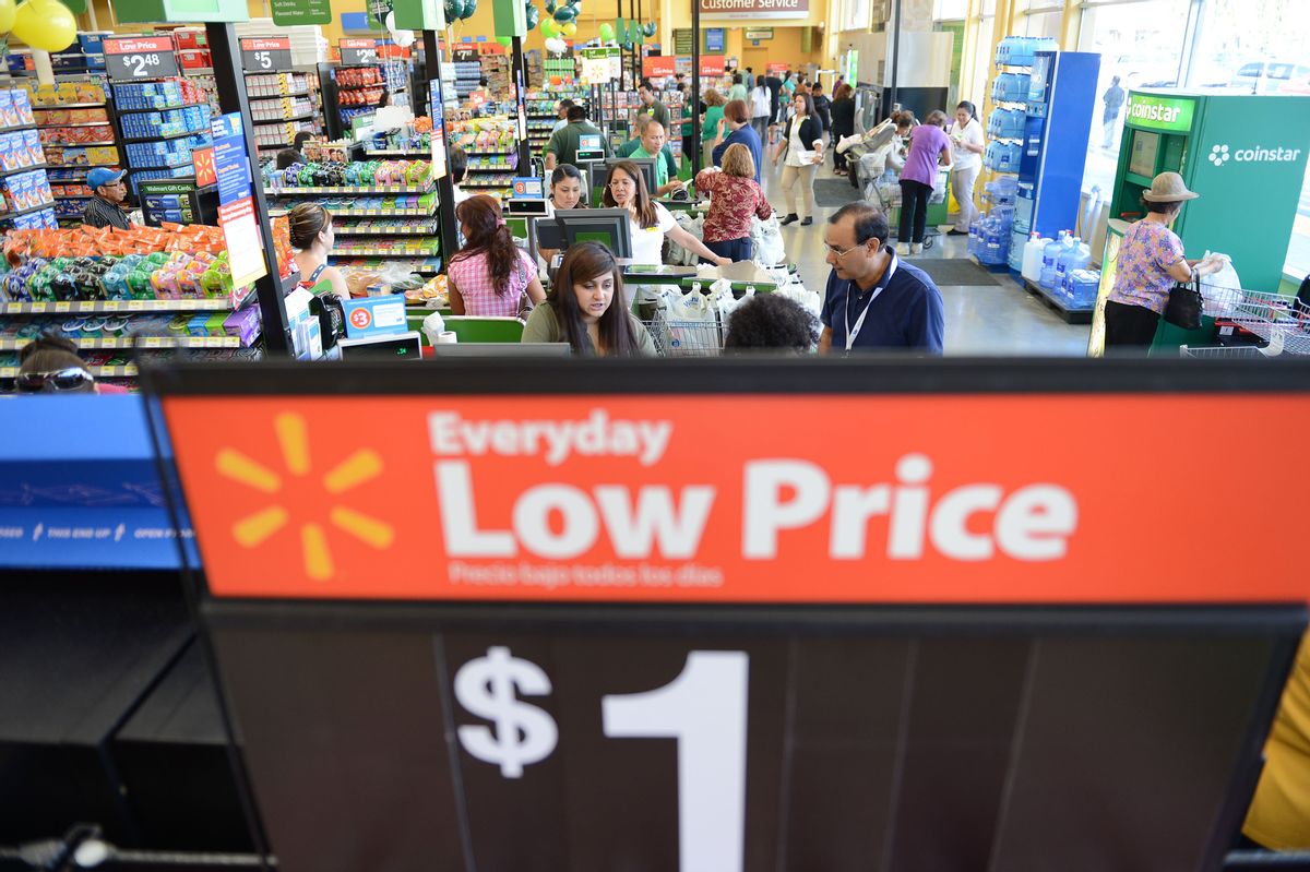 Shoppers pay for their purchases at the cash register during the Grand Opening of the new Walmart Neighborhood Market in Panorama City, California, a working class area about 13 miles (20km) northwest of Los Angeles, on September 28, 2012.  Smaller than Walmart's SuperCenter, the Neighborhood Market resembles a traditional supermarket, selling food, health and beauty products and home cleaning supplies.    AFP PHOTO / Robyn Beck        (Photo credit should read ROBYN BECK/AFP/GettyImages) (ROBYN BECK/AFP/Getty Images)