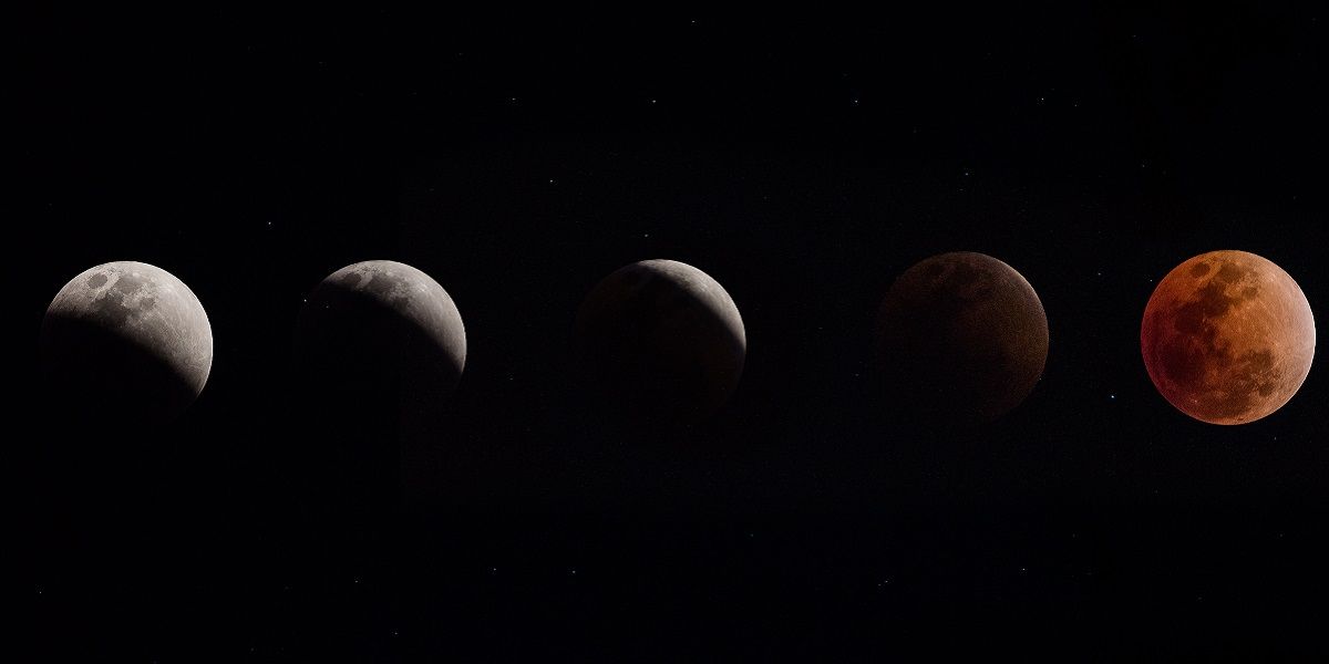 The transform of Half Lunar eclipse to full Lunar eclipse. The moon color become red. (Getty Images / Laphon Pinta)