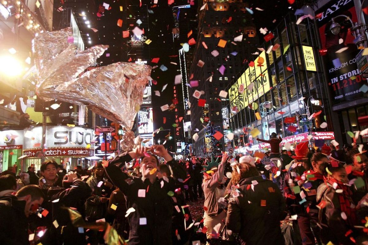 NEW YORK - JANUARY 01:  Revellers gather in Times Square on New Years Eve January 1, 2007 in New York City. People from around the globe watched the famous ball drop at midnight to ring in 2007.  (Photo by Spencer Platt/Getty Images) (Spencer Platt/Getty Images)