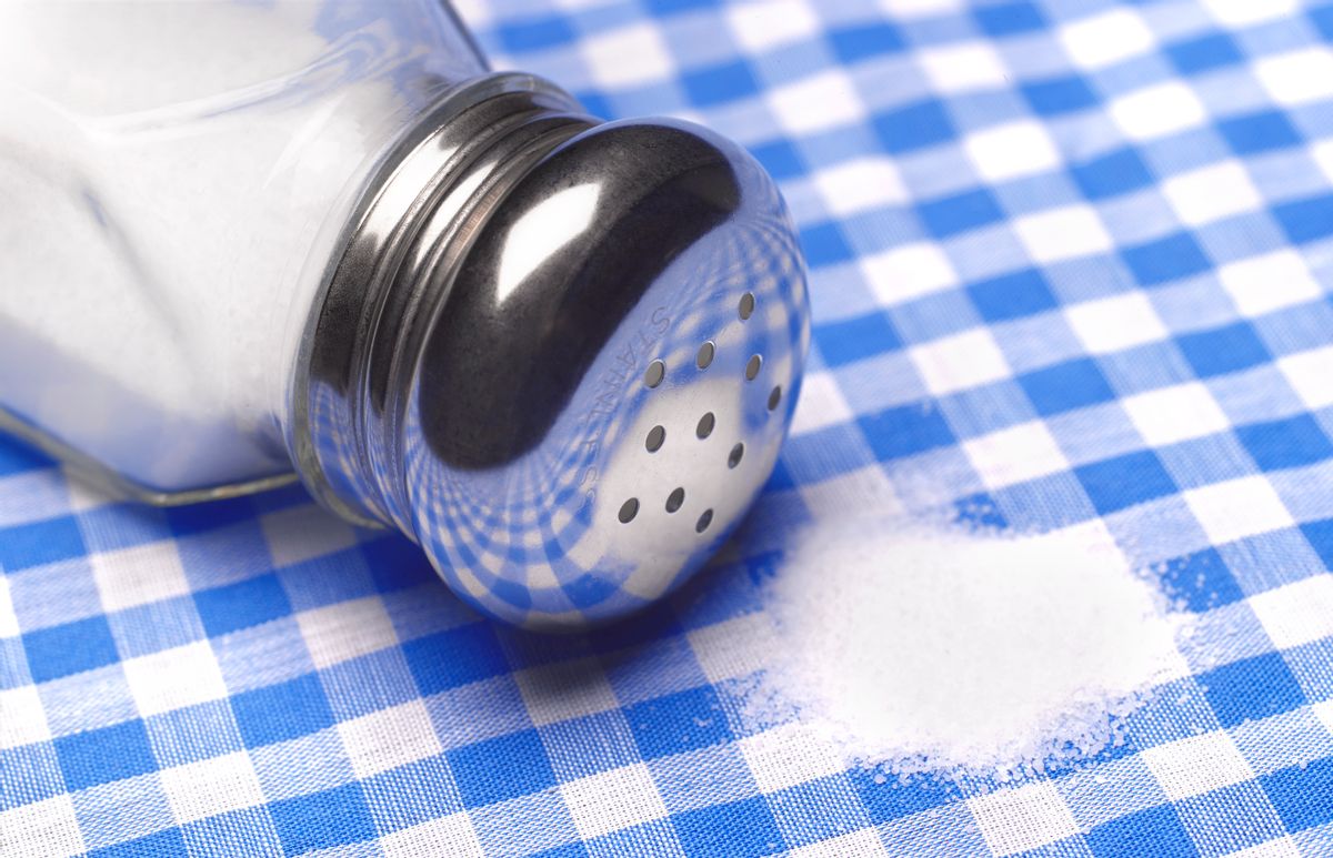 Close up of a pile of salt on a table cloth. (Peter Dazeley/Getty Images)