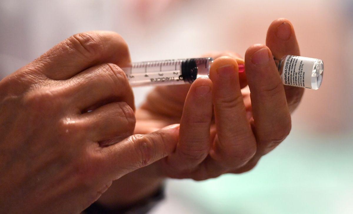 A nurse fills a syringe with the Pfizer-BioNtech coronavirus disease (Covid-19) vaccine on January 4, 2020 at the Antonin Balmes gerontology center in Montpellier in the south of France. - French president faced on January 4, 2020 growing pressure to accelerate France's Covid-19 vaccination drive which has seen just a few hundred people receive the jab. (Photo by Pascal GUYOT / AFP) (Photo by PASCAL GUYOT/AFP via Getty Images) (PASCAL GUYOT/AFP via Getty Images)