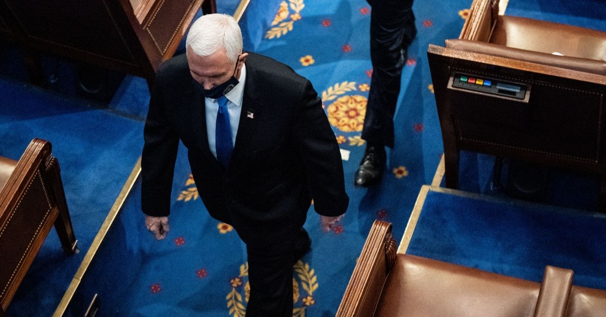 WASHINGTON, DC - JANUARY 06: U.S. Vice President Mike Pence walks off the House floor during a joint session of Congress to certify the 2020 Electoral College results on January 6, 2021 in Washington, DC. Congress held a joint session today to ratify President-elect Joe Biden's 306-232 Electoral College win over President Donald Trump. A group of Republican senators said they would reject the Electoral College votes of several states unless Congress appointed a commission to audit the election results. (Photo by Erin Schaff-Pool/Getty Images) (Erin Schaff-Pool/Getty Images)