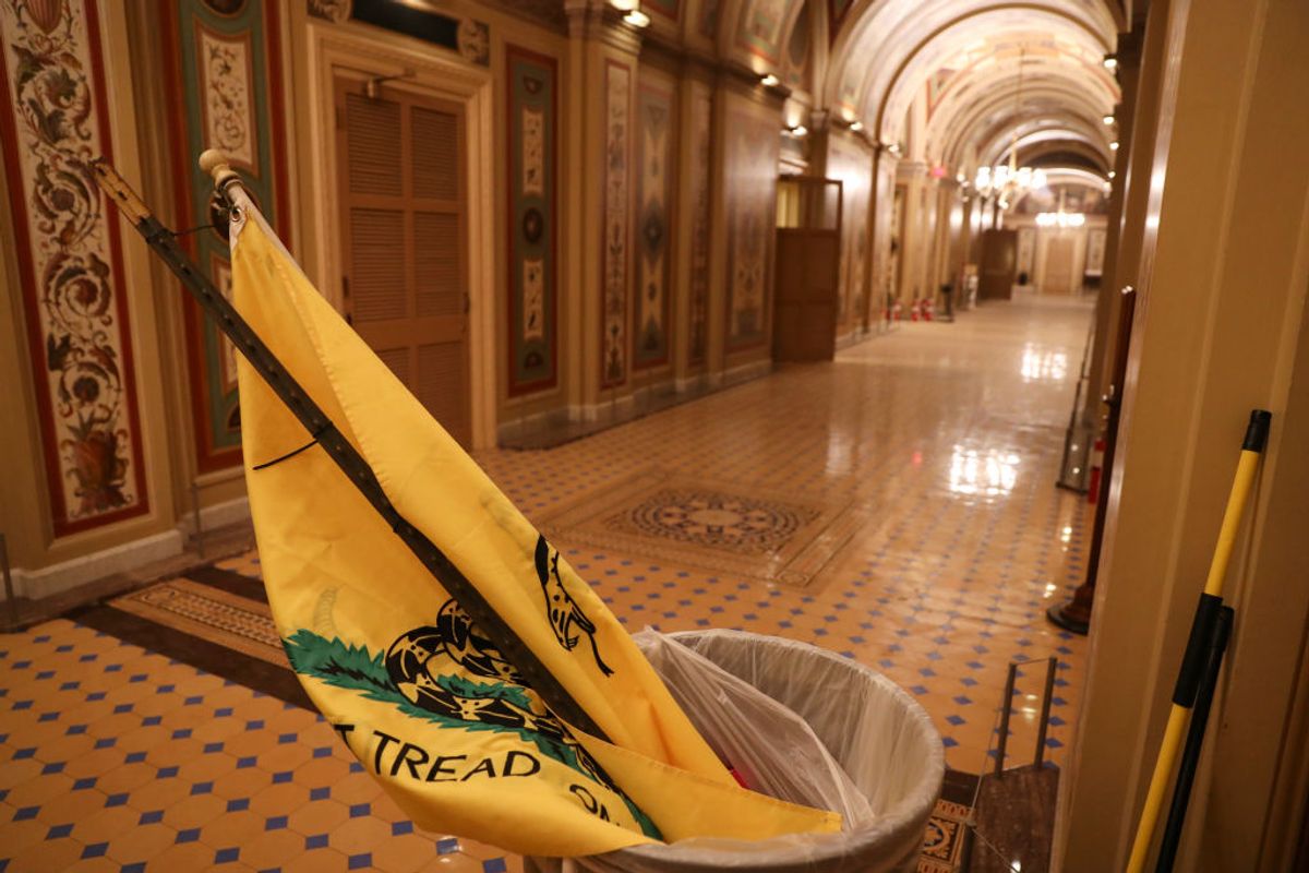 WASHINGTON, DC - JANUARY 6: A Gadsden Flag flag left by Pro-Trump protesters who entered the U.S. Capitol building is seen after mass demonstrations in the nations capital during a joint session Congress to ratify President-elect Joe Biden on January 06, 2021 in Washington, DC. (Photo by Oliver Contreras/For The Washington Post via Getty Images) (Getty Images)
