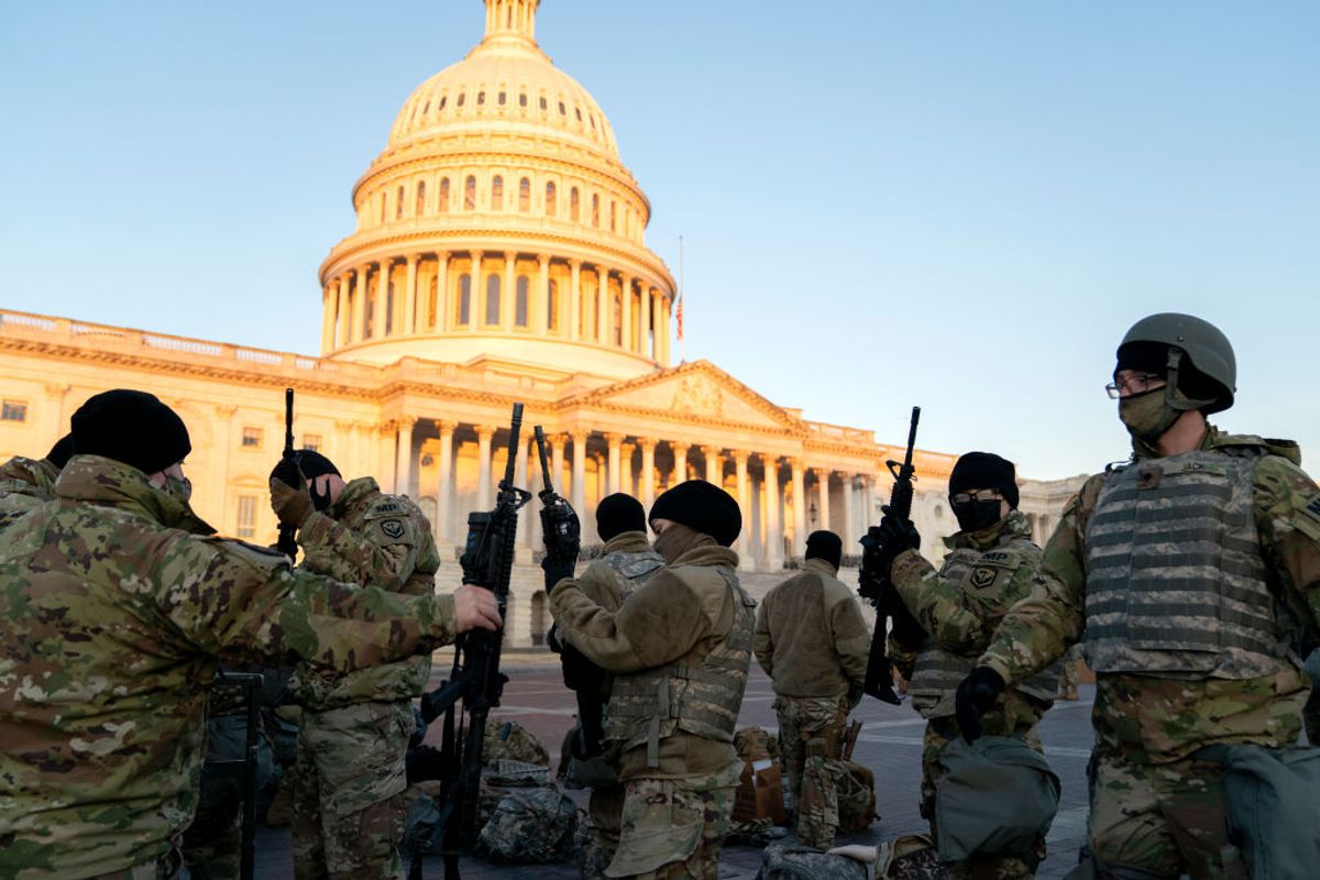 WASHINGTON, DC - JANUARY 13: Weapons are distributed to members of the National Guard outside the U.S. Capitol on January 13, 2021 in Washington, DC. Security has been increased throughout Washington following the breach of the U.S. Capitol last Wednesday, and leading up to the Presidential inauguration. (Photo by Stefani Reynolds/Getty Images) (Getty Images)
