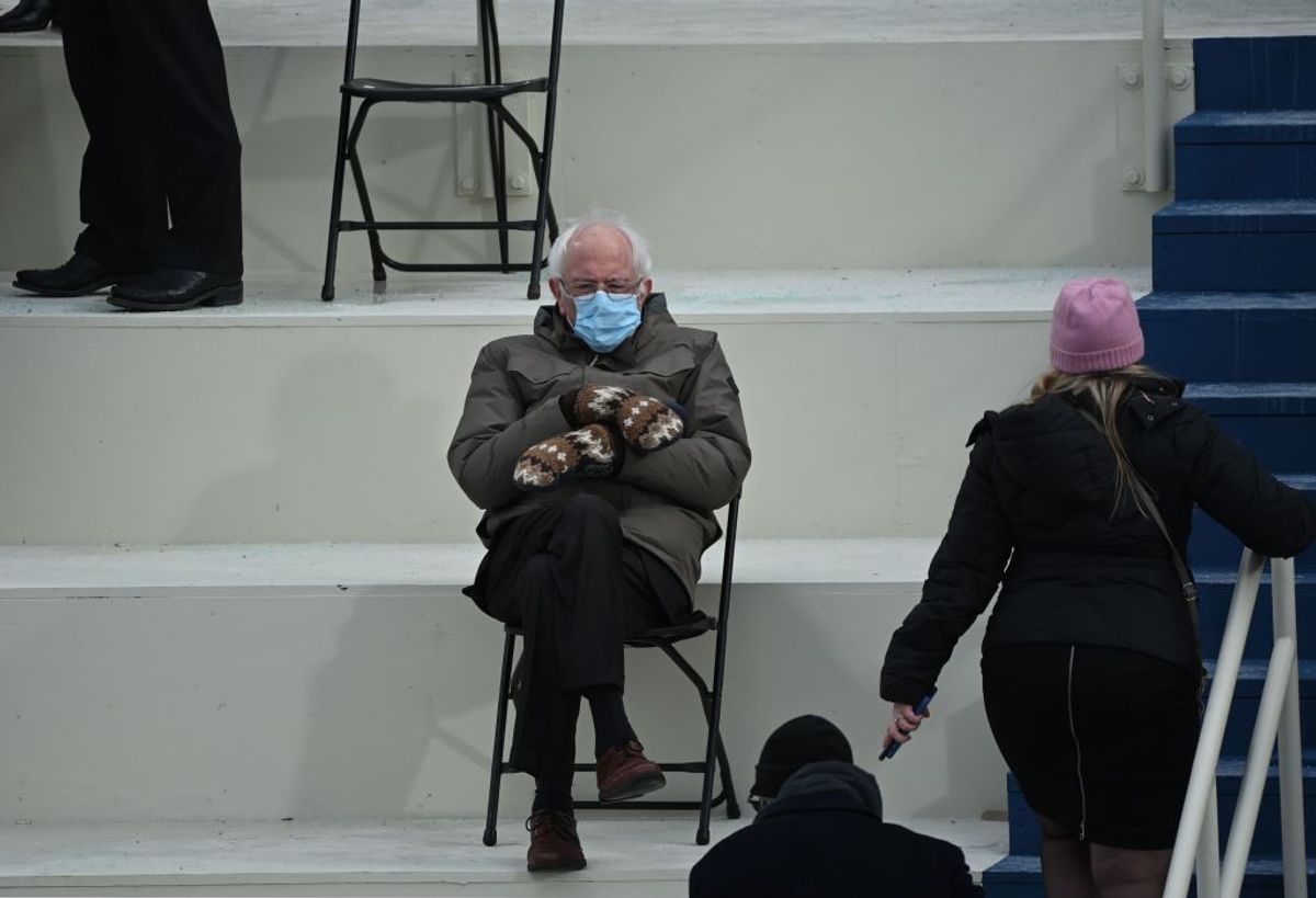 TOPSHOT - Former presidential candidate, Senator Bernie Sanders (D-Vermont) sits in the bleachers on Capitol Hill before Joe Biden is sworn in as the 46th US President on January 20, 2021, at the US Capitol in Washington, DC. (Photo by Brendan SMIALOWSKI / AFP) (Photo by BRENDAN SMIALOWSKI/AFP via Getty Images) (Getty Images)