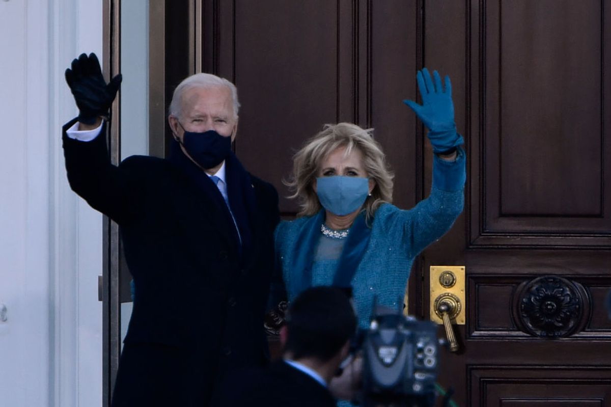 US President Joe Biden and First Lady Jill Biden wave as they arrive at the White House in Washington, DC, on January 20, 2021. (Photo by Patrick T. FALLON / AFP) (Photo by PATRICK T. FALLON/AFP via Getty Images) (PATRICK T. FALLON / Getty Images)