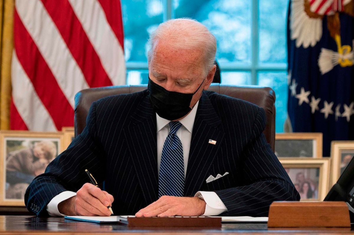 US President Joe Biden signs an Executive Order reversing  Trump era ban on Transgender serving in the military while in the Oval Office of the White House in Washington, DC, on January 25, 2021. (Photo by JIM WATSON / AFP) (Photo by JIM WATSON/AFP via Getty Images) (Jim Watson/Contributor)