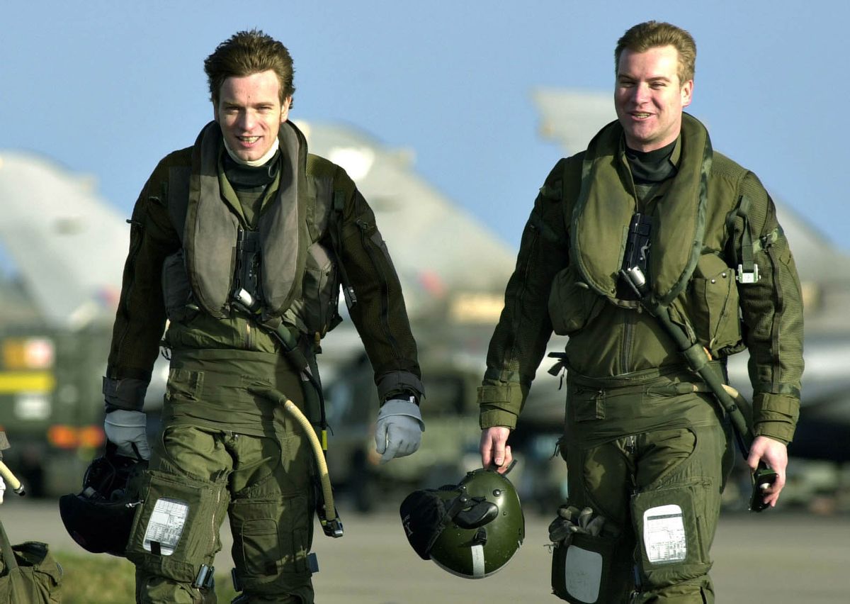 Film star Ewan McGregor (left) returns to RAF Lossiemouth in Moray,  after taking to the skies over Scotland in an RAF Tornado jet, piloted by his brother,  Flight Lieutenant Colin McGregor (right).    *  The hour long flight marked the launch of XV Squadron`s drive to raise funds for their chosen charity and was due to include a fly-past at children's hospice, Rachel House, in Kinross, Perthshire.   (Photo by David Cheskin - PA Images/PA Images via Getty Images) (David Cheskin - PA Images/PA Images via Getty Images)