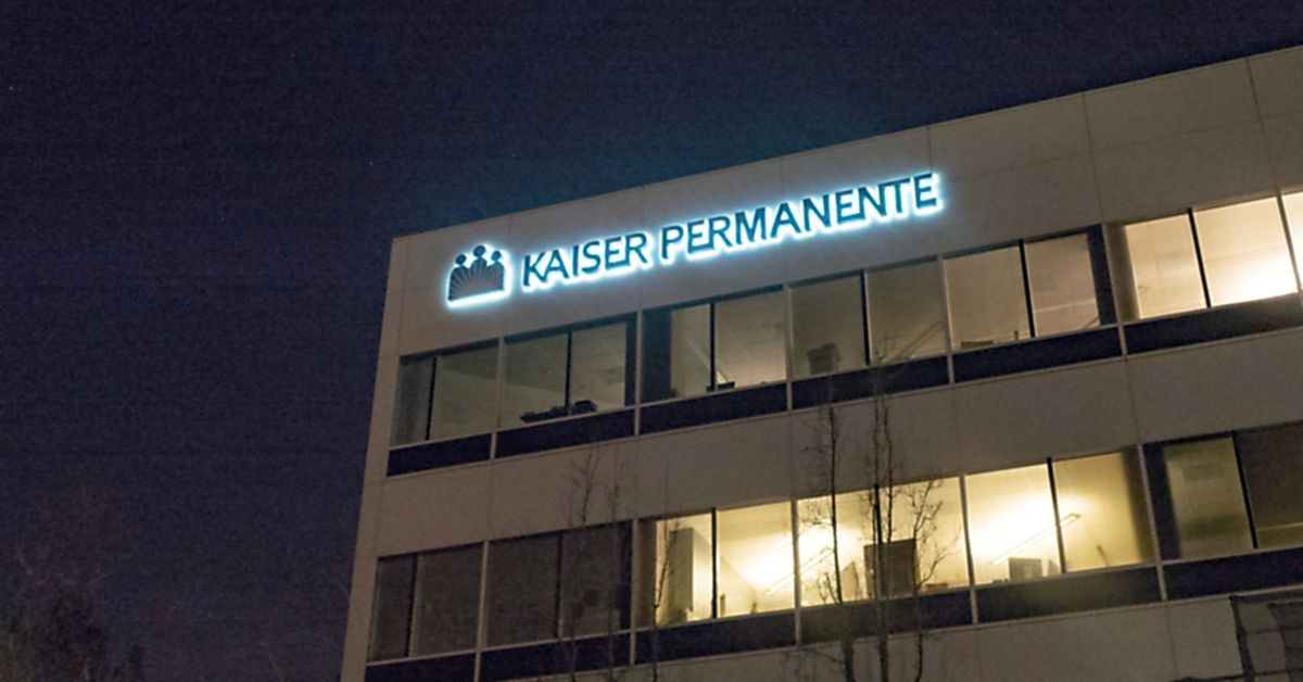 Facade with logo and sign at night at regional administrative headquarters of healthcare provider Kaiser Permanente in the San Francisco Bay Area, Dublin, California, March 5, 2018. (Photo by Smith Collection/Gado/Getty Images) (Smith Collection/Gado/Getty Images .)